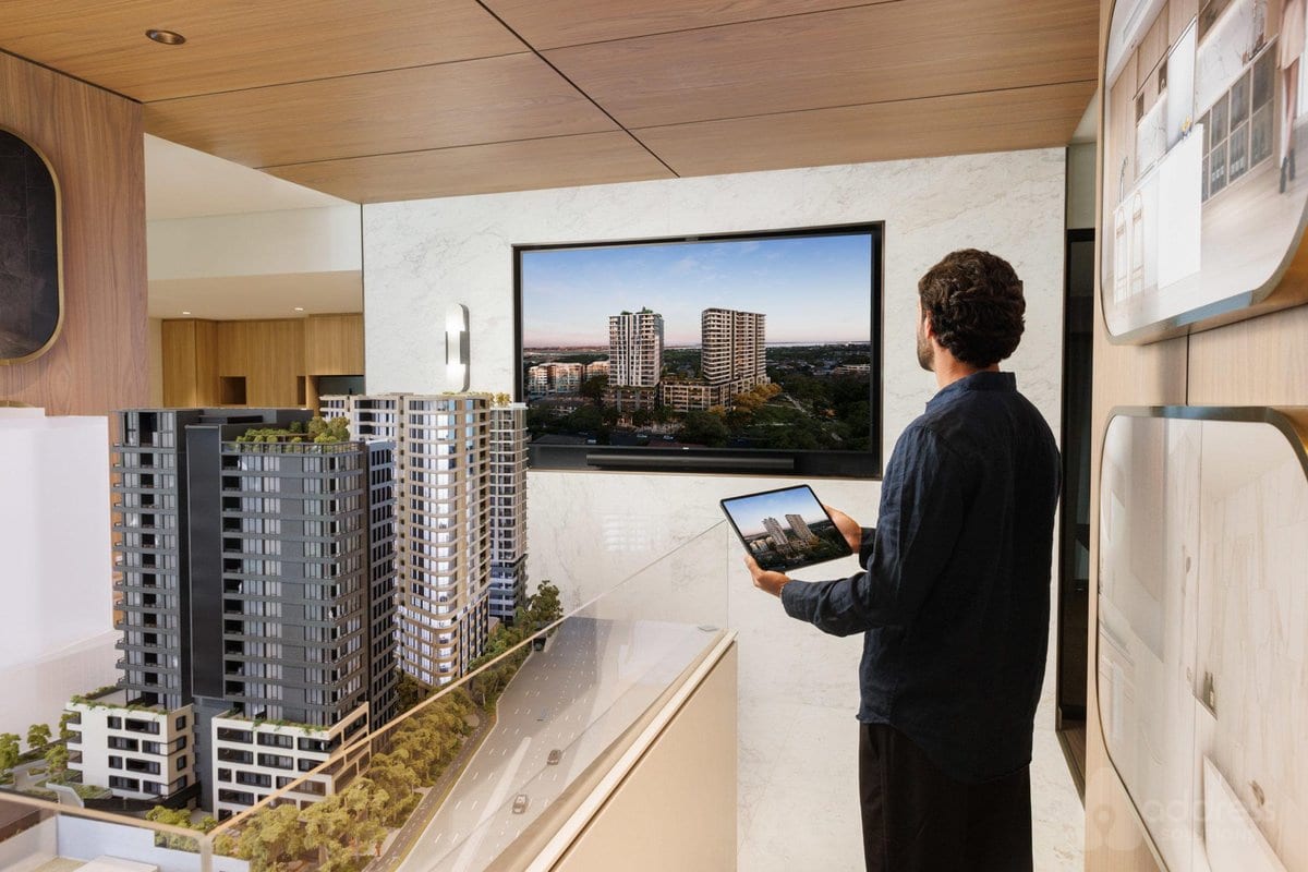 Investor reviewing a residential tower project model and presentation